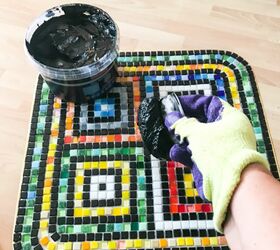 how to transform an old coffee table into a piece of functional art, Add grout to tiles and work in gaps