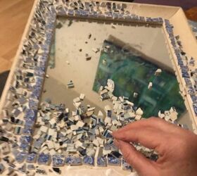 how to use up your broken china to decorate a mirror frame, Gradually building up the design