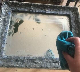 how to use up your broken china to decorate a mirror frame, Wipe off excess grout