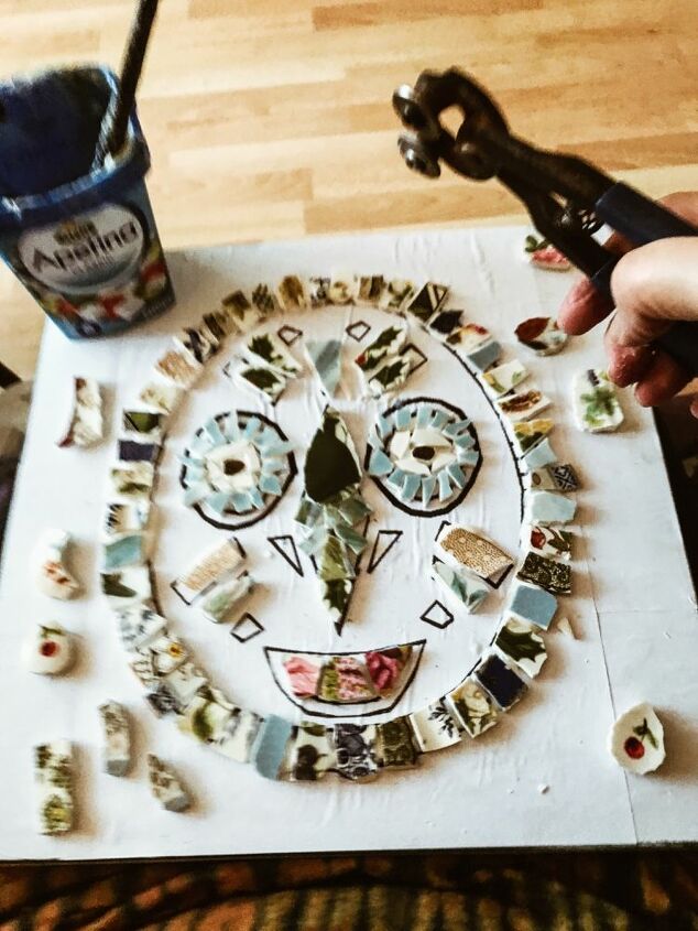 how to turn your smashed crockery into a piece of wall art, Sticking the china pieces to the mask