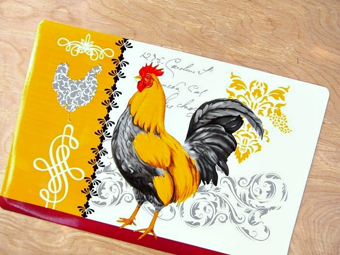 frame a rooster placemat and hang it on the wall