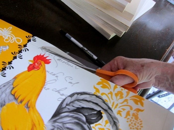 frame a rooster placemat and hang it on the wall