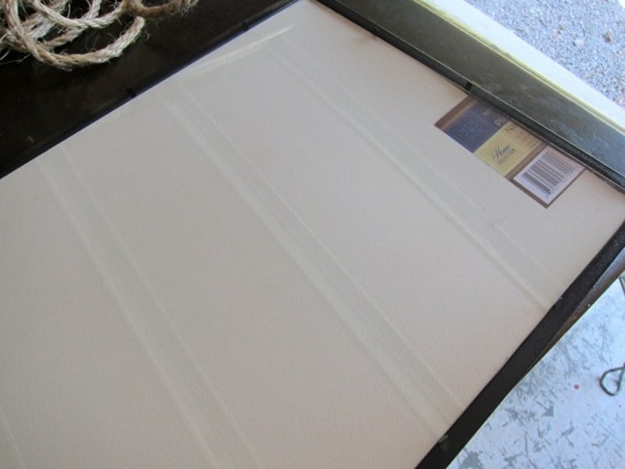frame a rooster placemat and hang it on the wall