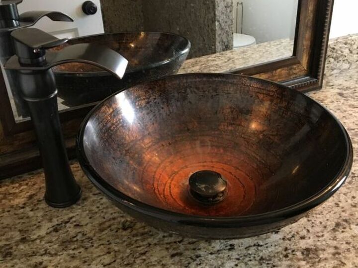 q how do i clean this water film off a glass vessel bowl sink