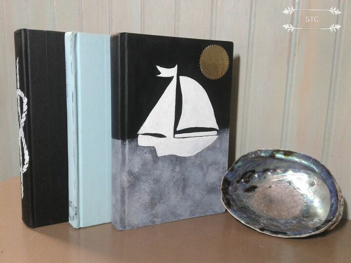 crie um novo visual decore com livros, Capa com modelo de veleiro