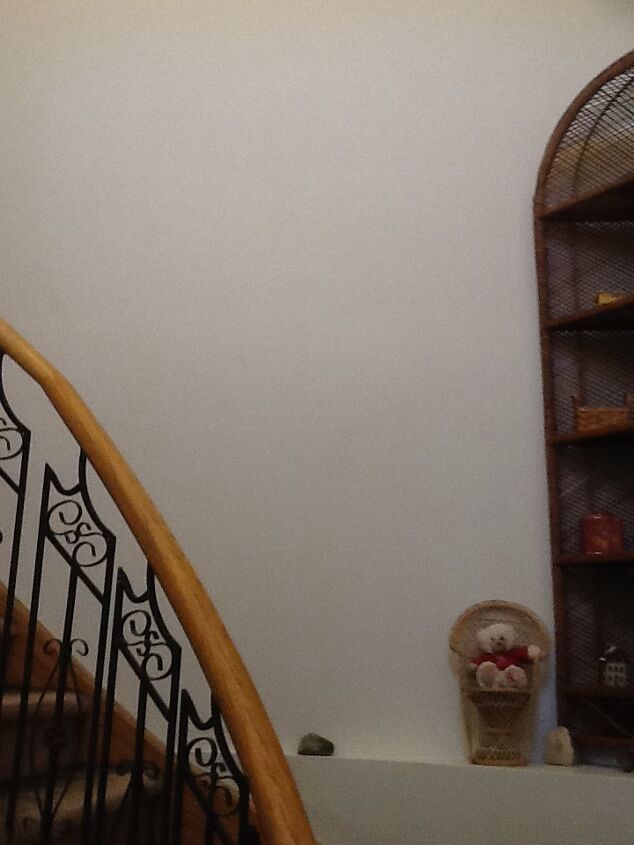 q how high up do you start hanging pictures on a stairway wall