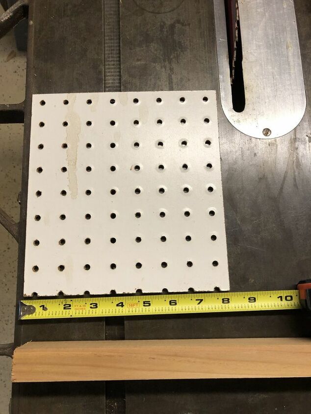 tips for accurately installing cabinet hardware, Scrap of pegboard for accurate hole drilling