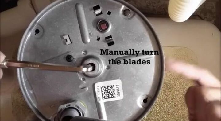 the quick and easy 5 minute fix for a clogged garbage disposal, Turn Blade Manually Above Sink