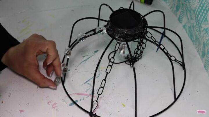 how to create a diy outdoor solar chandelier, Glue Glass Gems onto the Basket