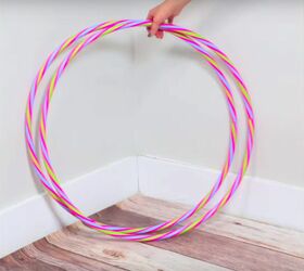 Spray paint 2 hula hoops to get a little extra storage space