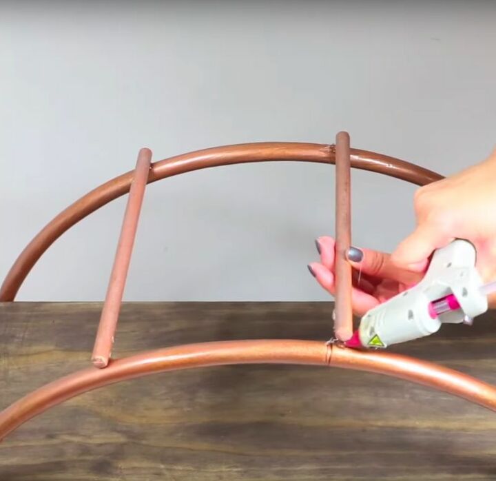 how to build a hula hoop shelf a stylish storage solution, Add Dowels at the Bottom to Stabilize