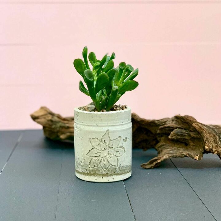 a cement planter with an inset design using a cricut