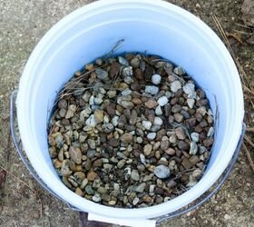 Fill the bottom of a bucket with pebbles to make your spring porch look amazing