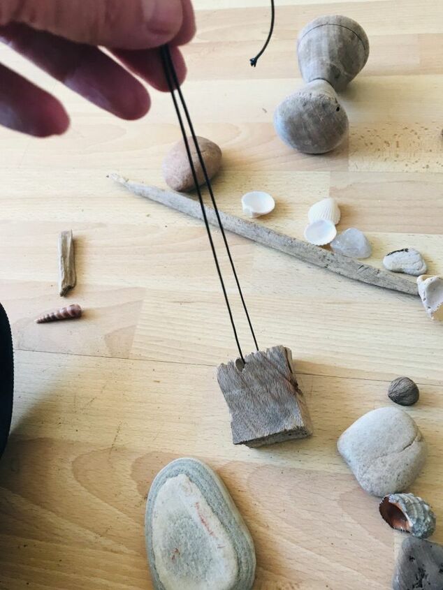 how to make a beautiful piece of wall art from beach finds, Tie driftwood piece to the cord