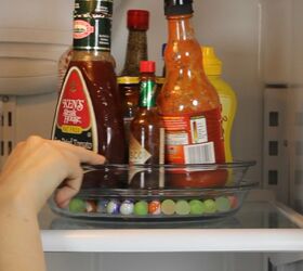 s 15 helpful kitchen organizing tricks you can do in under an hour, Make a Lazy Susan to Organize Your Fridge