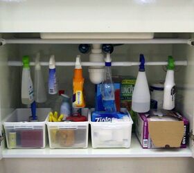 s 15 helpful kitchen organizing tricks you can do in under an hour, Organize Under the sink with a Tension Rod