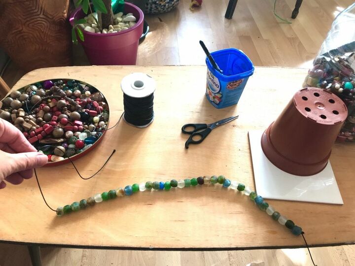how to transform your plastic plant pots with beads, Make string of beads