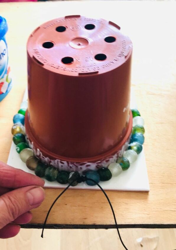 how to transform your plastic plant pots with beads, Glue beads to pot