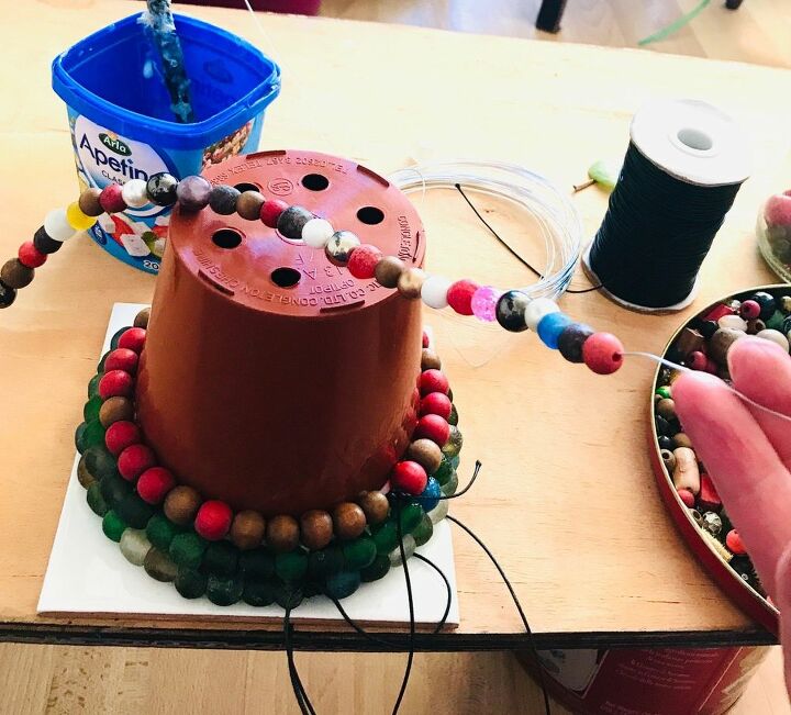 how to transform your plastic plant pots with beads, Glue beads to plant pot