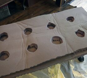 She cuts holes in a mattress topper to give her coffee table an amazing upgrade