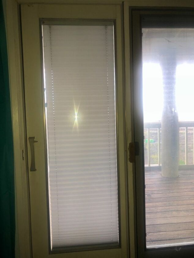 q how do i fix a curtain hanging inside my sliding glass door