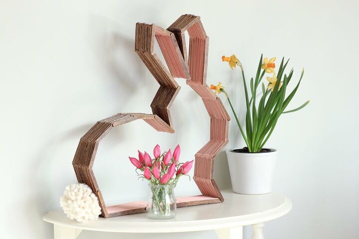 s 15 spring decor ideas that will brighten your home this week, Glue together popsicle sticks for bunny decor