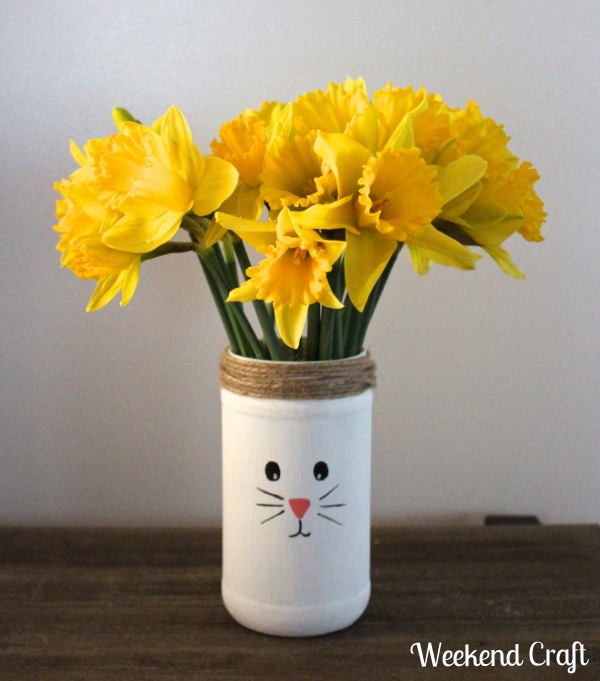 s 15 playful easter decorations that go beyond colorful eggs, Repurpose a food jar into a bunny vase