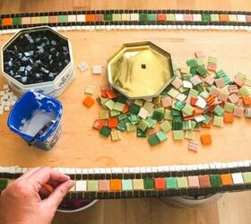 how to transform a coffee table with mosaic art, Adding tiles to table with PVA glue
