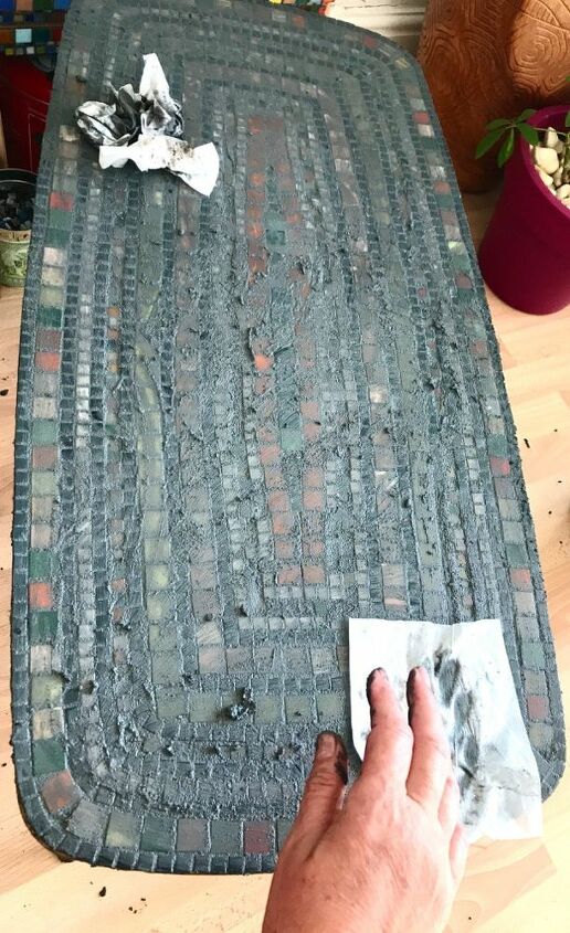 how to transform a coffee table with mosaic art, Cleaning off grout