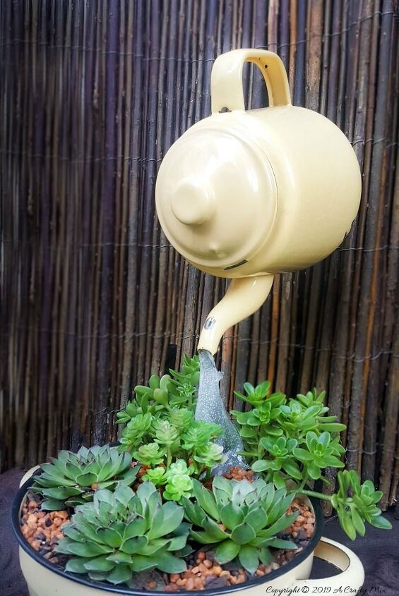 15 crazy creative ways to reuse old pots and pans around your home, Make a floating planter from a teapot bowl fork