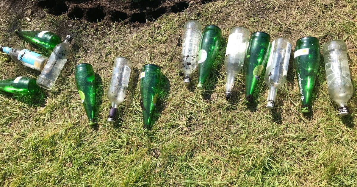 How To Use Your Old Glass Bottles To Create Nice Flower Bed Border