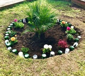 how to use your old glass bottles to create nice flower bed border, Bottle border