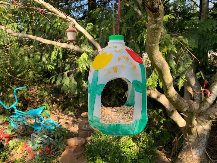 16 fun craft ideas you could do with your kids, This tasty milk jug bird feeder