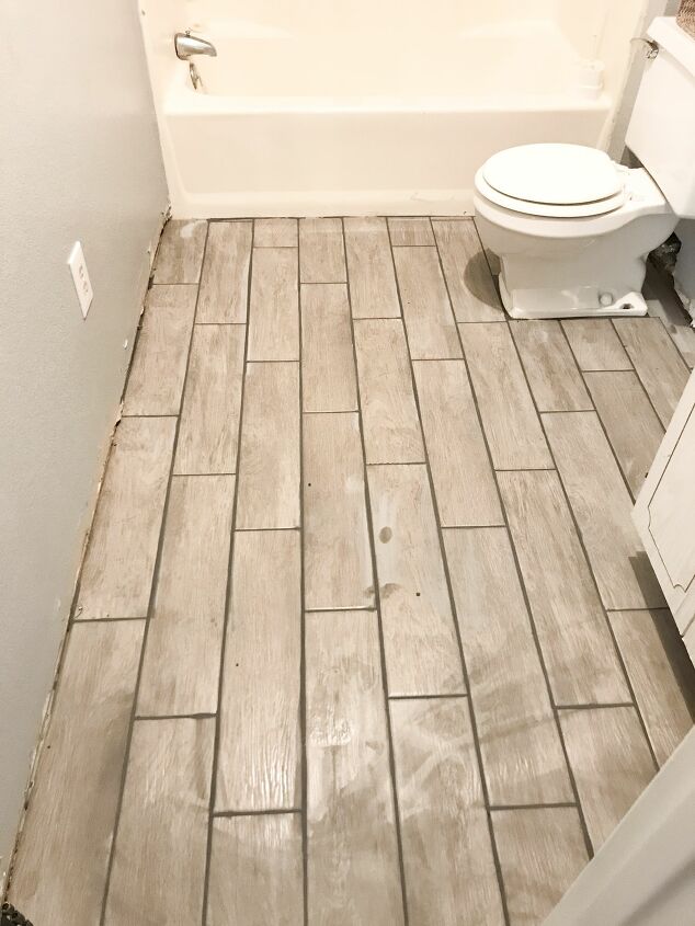 12 creative bathroom floor upgrades you can do without a full reno, Install ceramic tiles