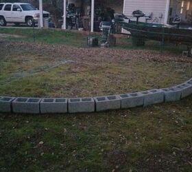 She laid out a row of cinder blocks to get bonus garden space in her backyard