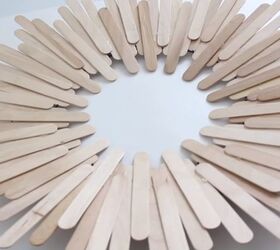 unlock your creativity with these simple popsicle stick decorations, Glue Popsicle Sticks to the Wreath Frame