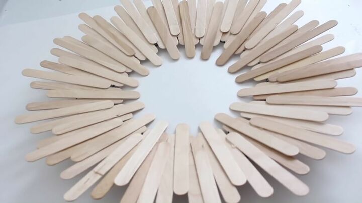 unlock your creativity with these simple popsicle stick decorations, Glue Popsicle Sticks to the Wreath Frame