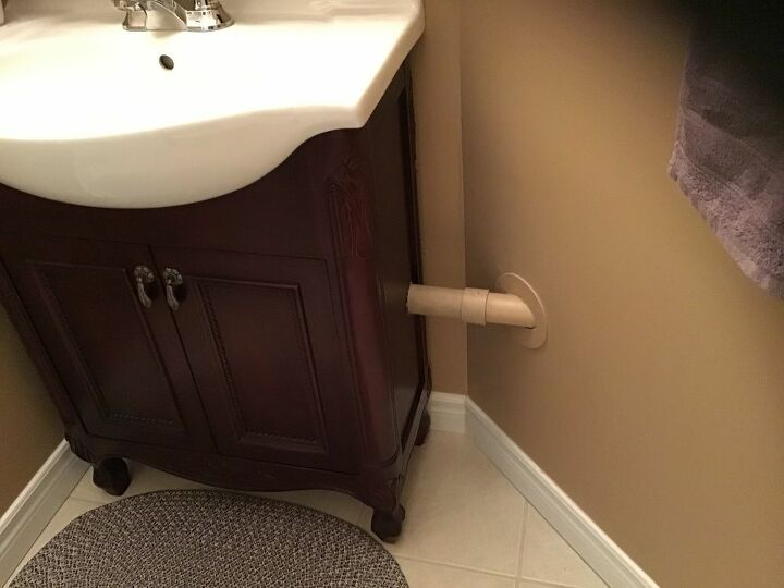 q how can l hide this bathroom pipe in my powder room