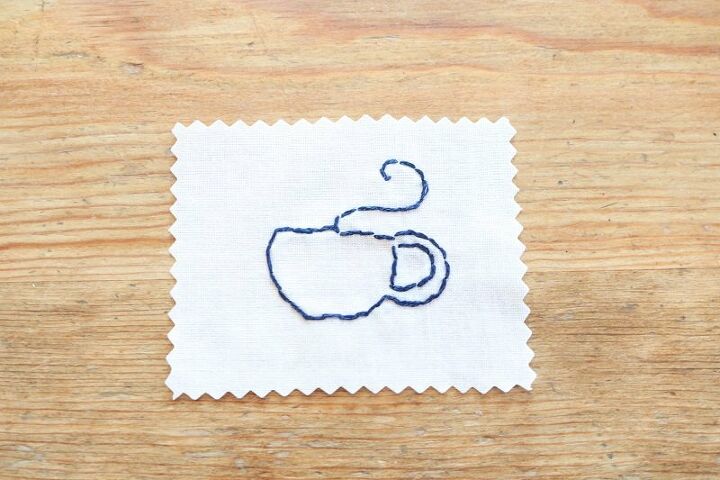 tea towel with tea cup embroidery