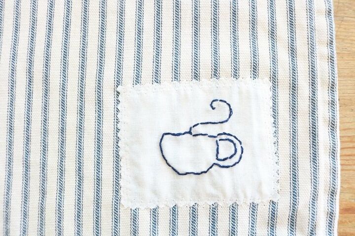 tea towel with tea cup embroidery