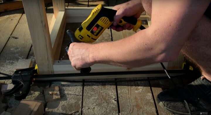 recycle old wood into a chic wood and glass coffee table, Insert Drill at an Angle