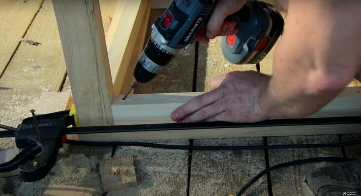 recycle old wood into a chic wood and glass coffee table, Drive the Screws