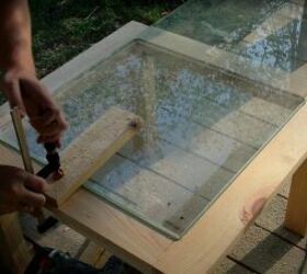 recycle old wood into a chic wood and glass coffee table, Clamp