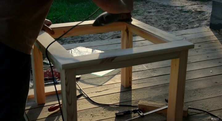 recycle old wood into a chic wood and glass coffee table, Sand the Wood