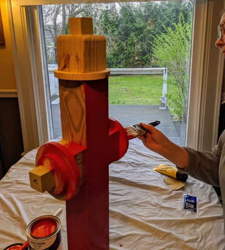 how to cheaply easily make a diy fire hydrant for your doggy, Painting the doggy fire hydrant red