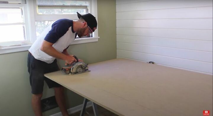put together an easy modern farmhouse barn door in only 8 steps, Cut the MDF Sheet