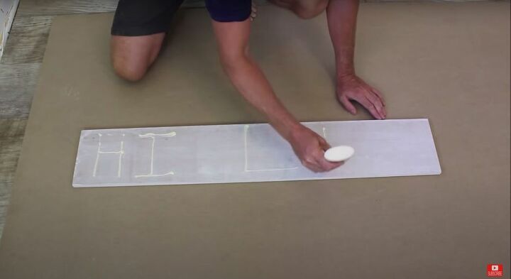 put together an easy modern farmhouse barn door in only 8 steps, Glue the MDF Boards to the Door