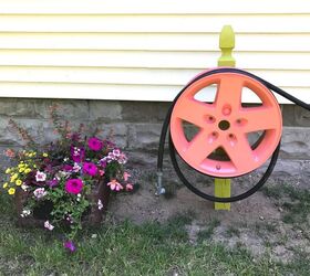 s 8 best ways to brighten up your garden this year, Tire Rim Water Hose Holder