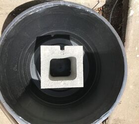 She puts a cinder block in a pot for this quick and creative patio makeover