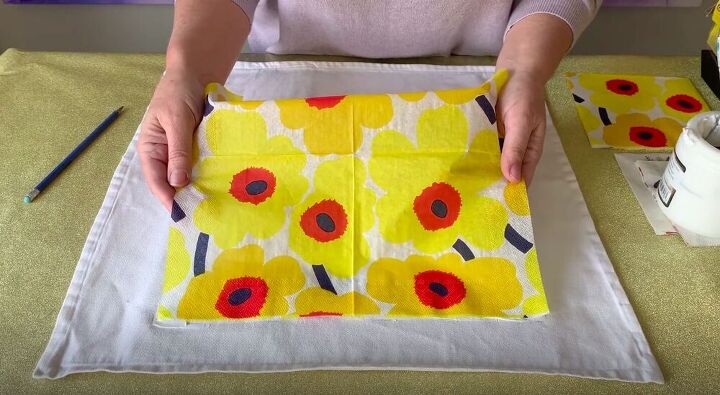 create a diy decorative pillow using napkins and glue, Lay the Napkin on the Glue